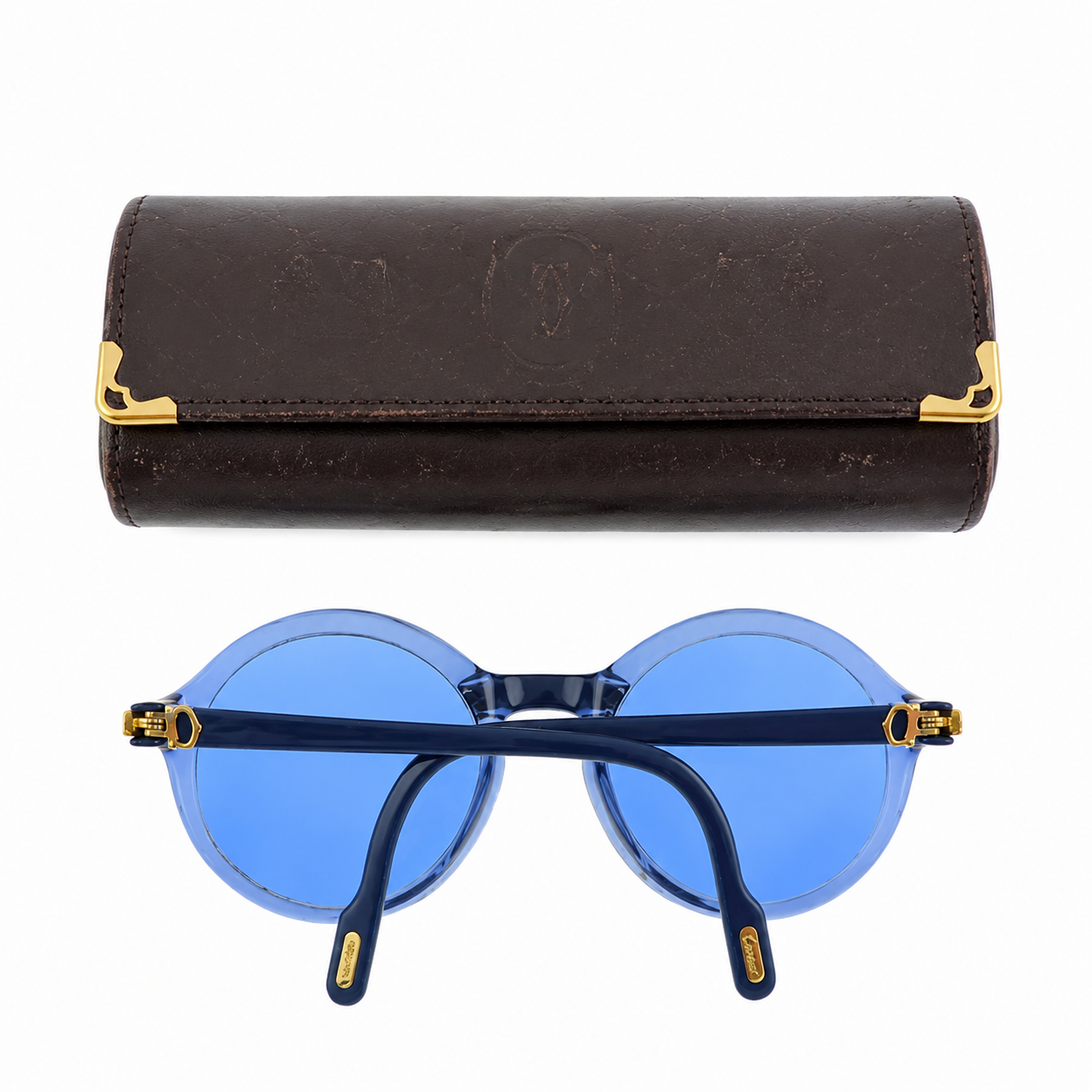 Cartier prescription sunglasses with blue frames and dark tinted lenses, stylish and protective eyewear for everyday wear.