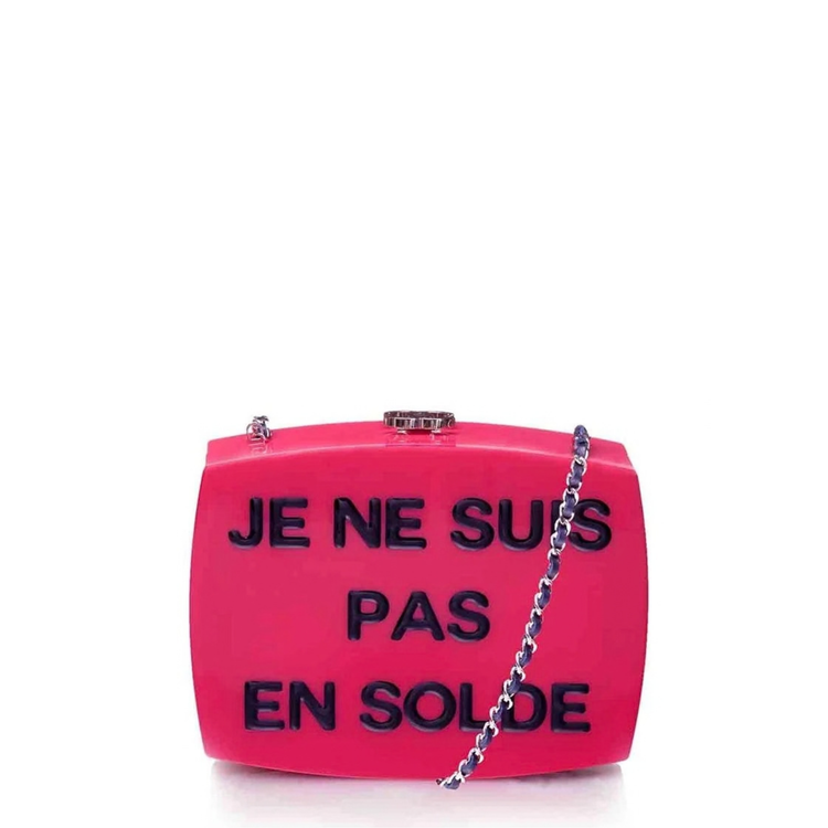 Pink Chanel SS 2015 Minaudiere clutch made of glossy plexiglass with a sleek, modern design and gold-tone hardware.