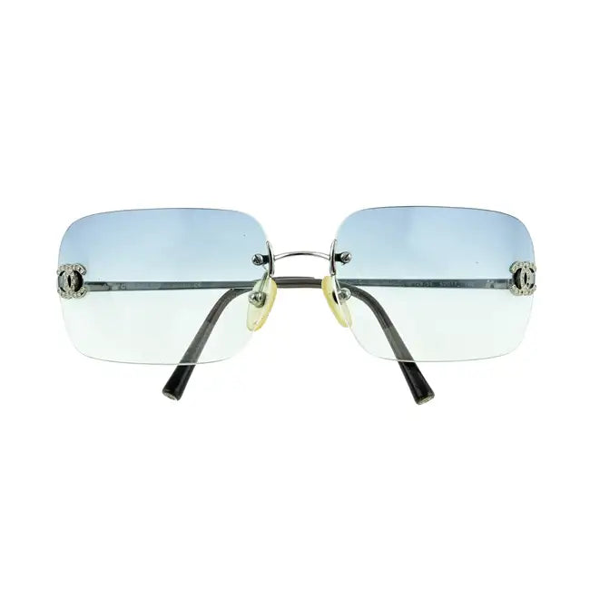 Chanel blue rimless sunglasses with sleek, modern design and transparent lenses, stylish eyewear for a sophisticated look.