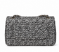 Chanel Silver Tweed Sequins Jumbo Double Flap Shoulder Bag shown from the back, featuring silver tweed fabric and sequined embellishments.