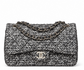 Silver tweed Chanel shoulder bag with sequins and double flap design, front view showcasing elegant craftsmanship.