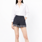 Blue and white striped tweed shorts by Chanel, featuring a stylish tailored design and classic plaid pattern.