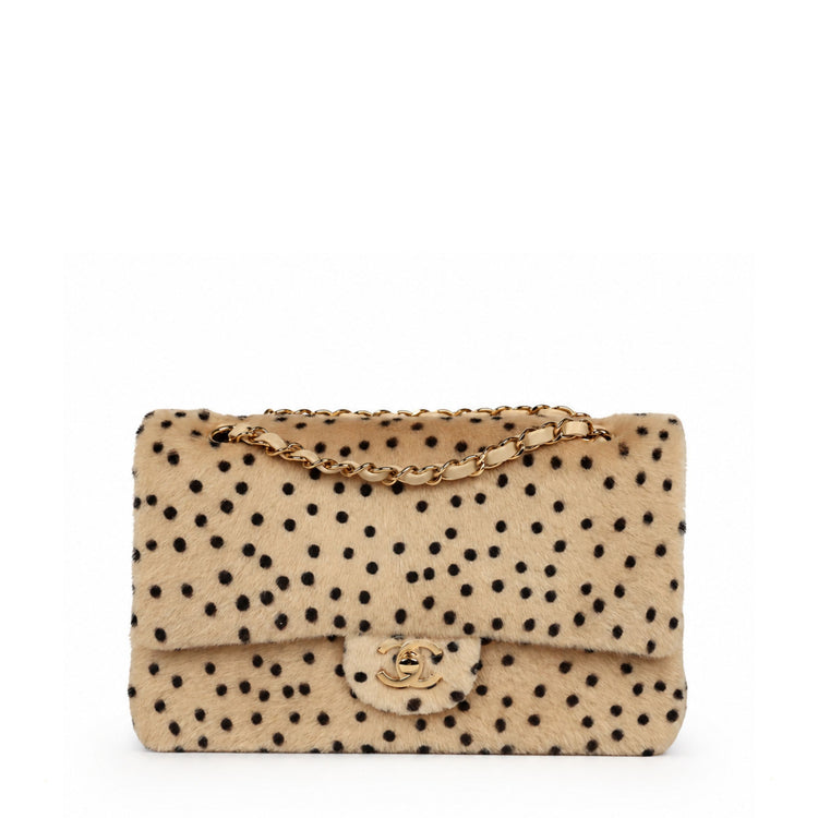 Chanel cheetah print medium flap handbag with gold hardware, featuring a stylish animal print design and elegant craftsmanship.