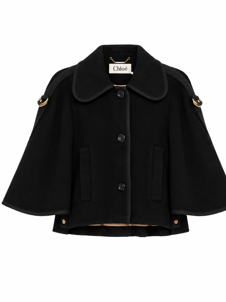 Chloé black cape-collar coat displayed on a white background, showcasing its elegant design and classic silhouette.