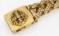 Gold-tone Cuban link chain bracelet featuring a large square clasp adorned with a cross motif and pavé-set clear stones, shown on a white background.