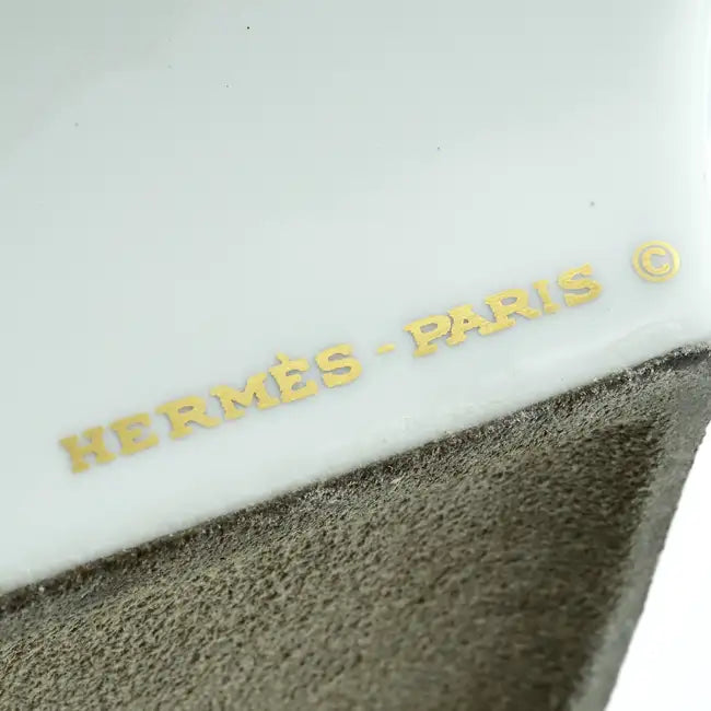 Hermès butterfly-shaped ashtray made of glossy ceramic with detailed butterfly design and vibrant colors.