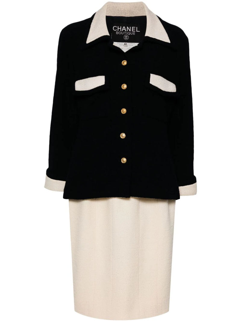 Chanel single-breasted bouclé skirt suit set featuring a tailored blazer and matching skirt in textured fabric.
