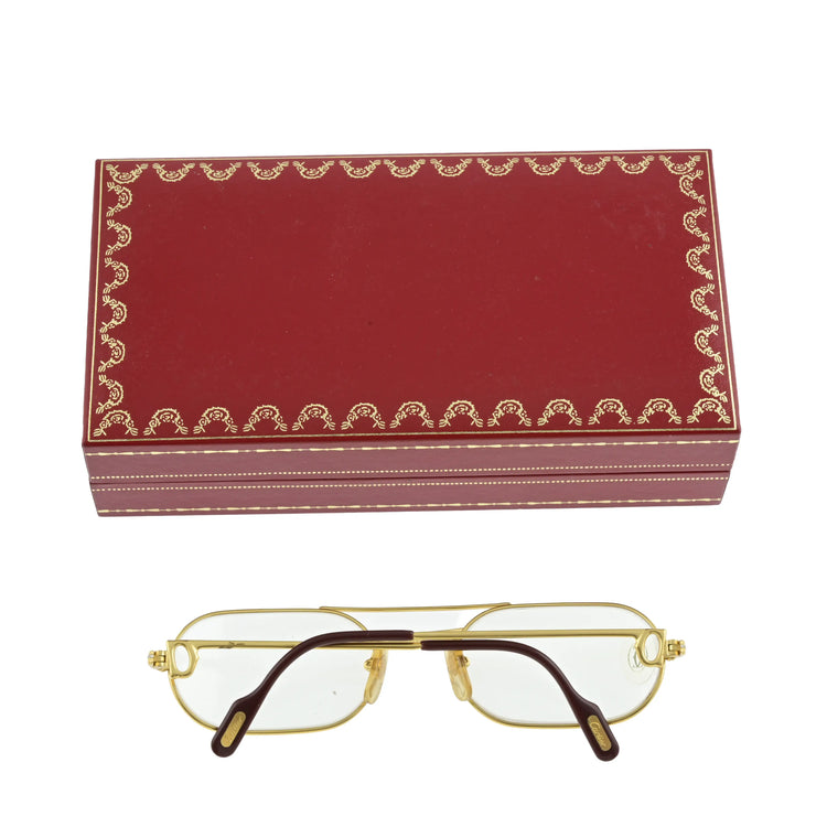 Vintage Louis Cartier sunglasses with round tinted lenses and classic metal frames, stylish eyewear for a sophisticated look.