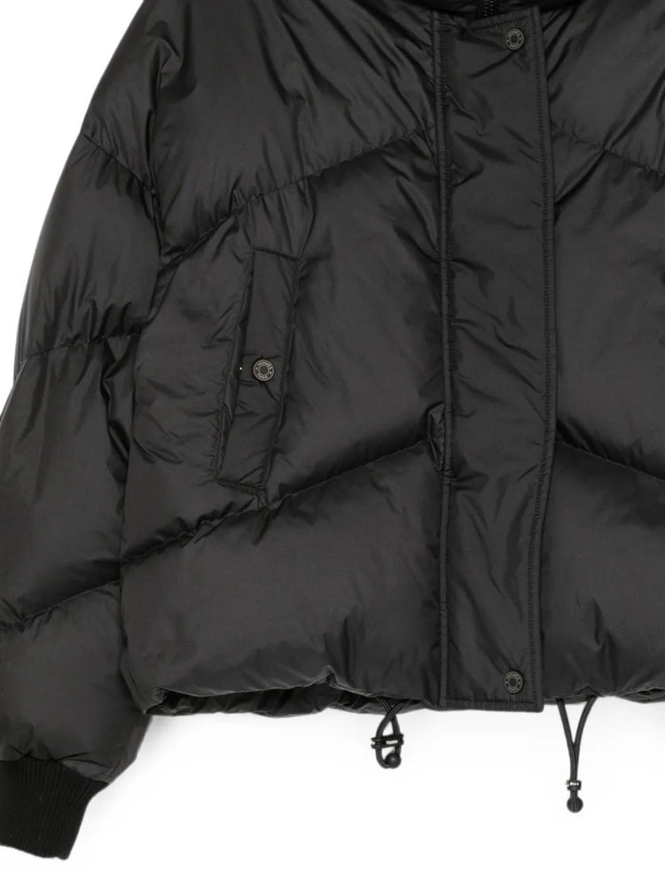 Hermès quilted puffer jacket for women, featuring a stylish, padded coat with a luxe finish and quilted design.