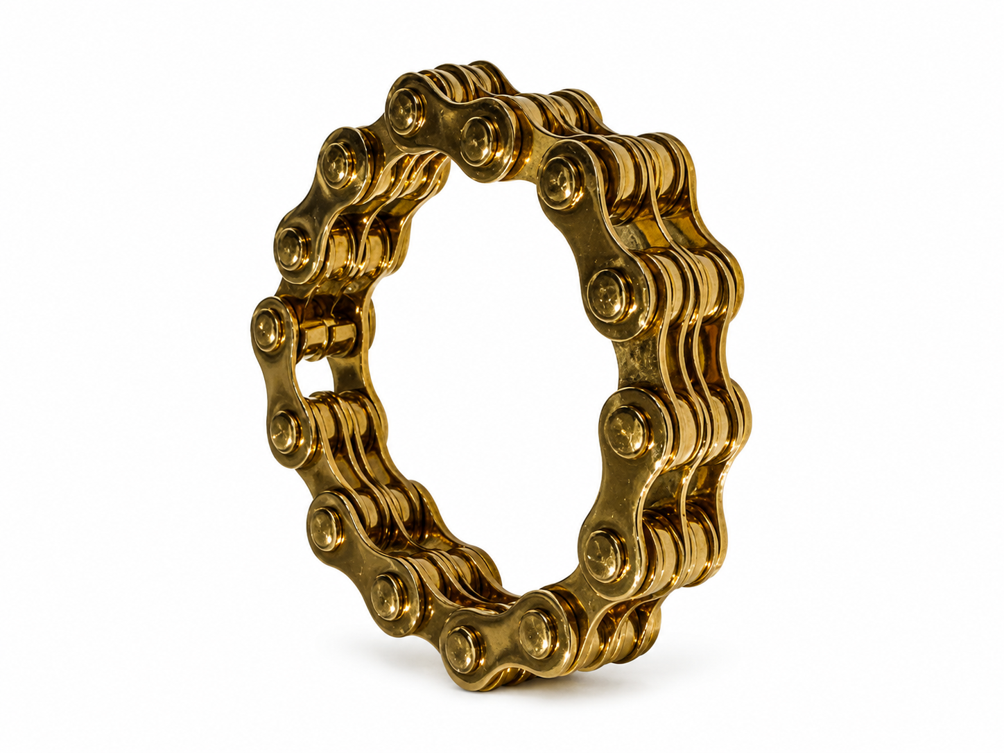 A gold-colored vintage archival bicycle chain John Galliano for Dior bracelet from 2000 made from a bicycle chain link, shown on a plain white background.
