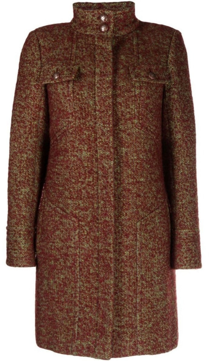 Chanel Fall 2014 runway bouclé coat in beige with textured fabric and classic design, displayed on a runway model.