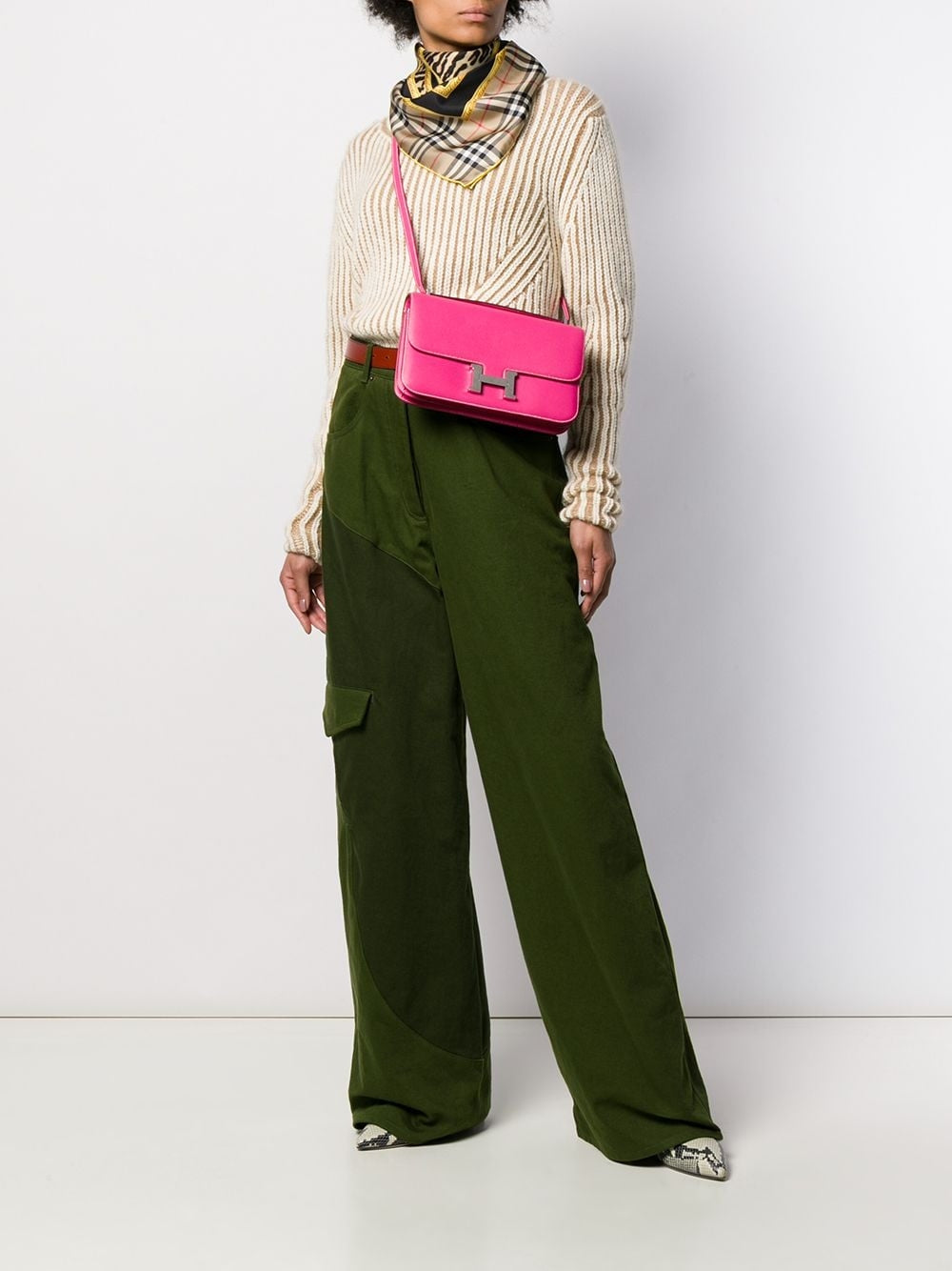 Hermès Tyrien pink Epsom leather Constance Elan shoulder bag with gold hardware, showcasing its elegant design and structured shape.