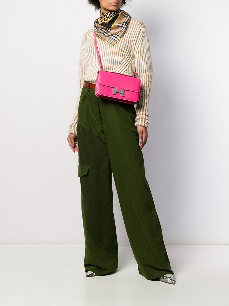 Hermès Tyrien pink Epsom leather Constance Elan shoulder bag with gold hardware, showcasing its elegant design and structured shape.