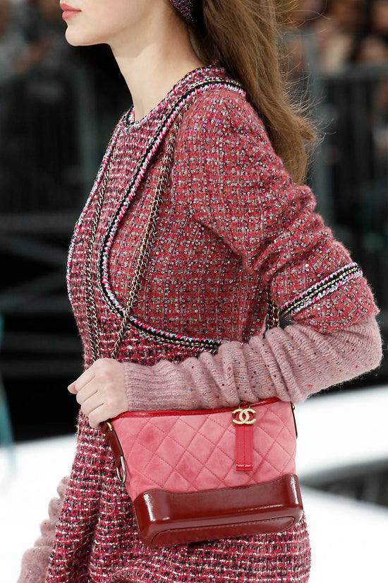 Chanel Suede Gabrielle Shoulder Bag with gold-tone hardware and adjustable strap, featuring a stylish and sophisticated design.