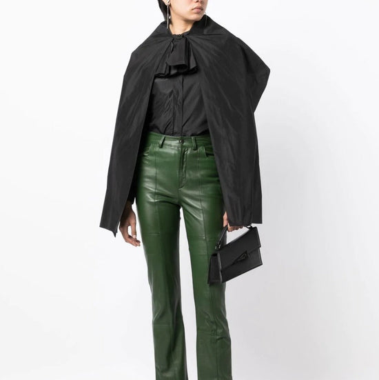 Black layered silk blouse from Yves Saint Laurent, elegant top with flowing fabric and sophisticated design.