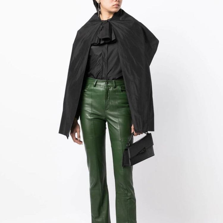 Black layered silk blouse from Yves Saint Laurent, elegant top with flowing fabric and sophisticated design.