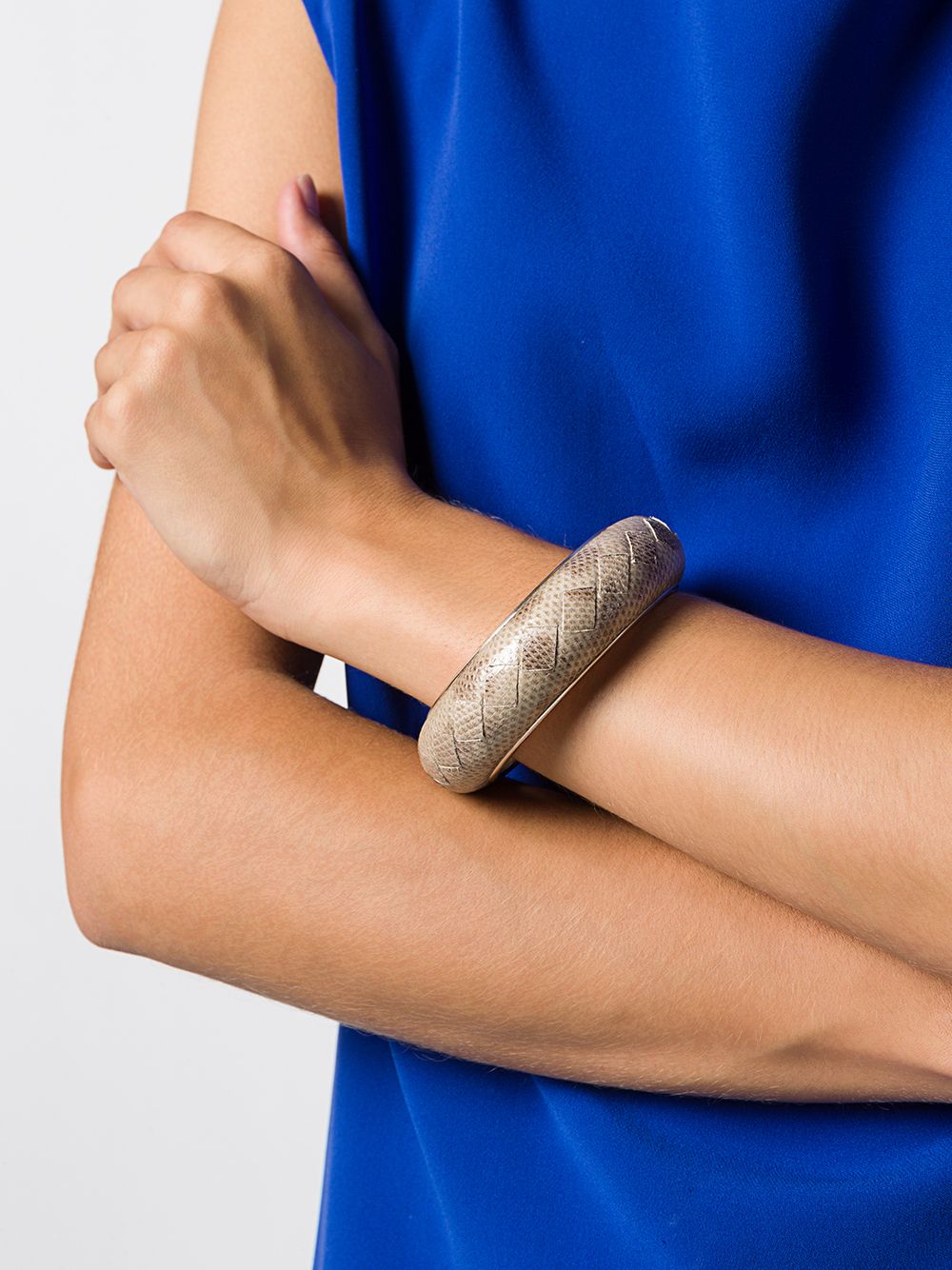 Bottega Veneta cuff bracelet featuring sleek, modern design with smooth leather finish and signature intrecciato pattern.