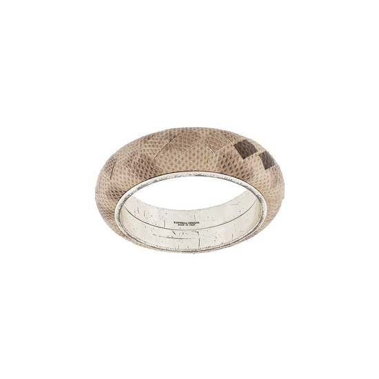 Bottega Veneta taupe-grey leather cuff bracelet with woven-inspired textured detailing and a wide rounded silhouette.