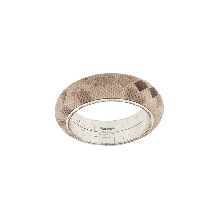Bottega Veneta taupe-grey leather cuff bracelet with woven-inspired textured detailing and a wide rounded silhouette.