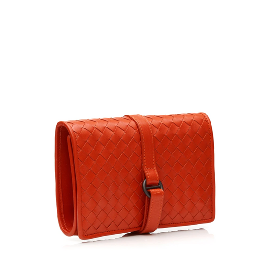 Bottega Veneta red Intrecciato leather jewellery pouch with woven exterior, strap and ring fastening, jewellery holders, zipped compartment and internal storage.