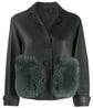 Burberry Prorsum black leather jacket with collar, button-front fastening, cropped silhouette, long sleeves, and oversized fur-trimmed front patch pockets.