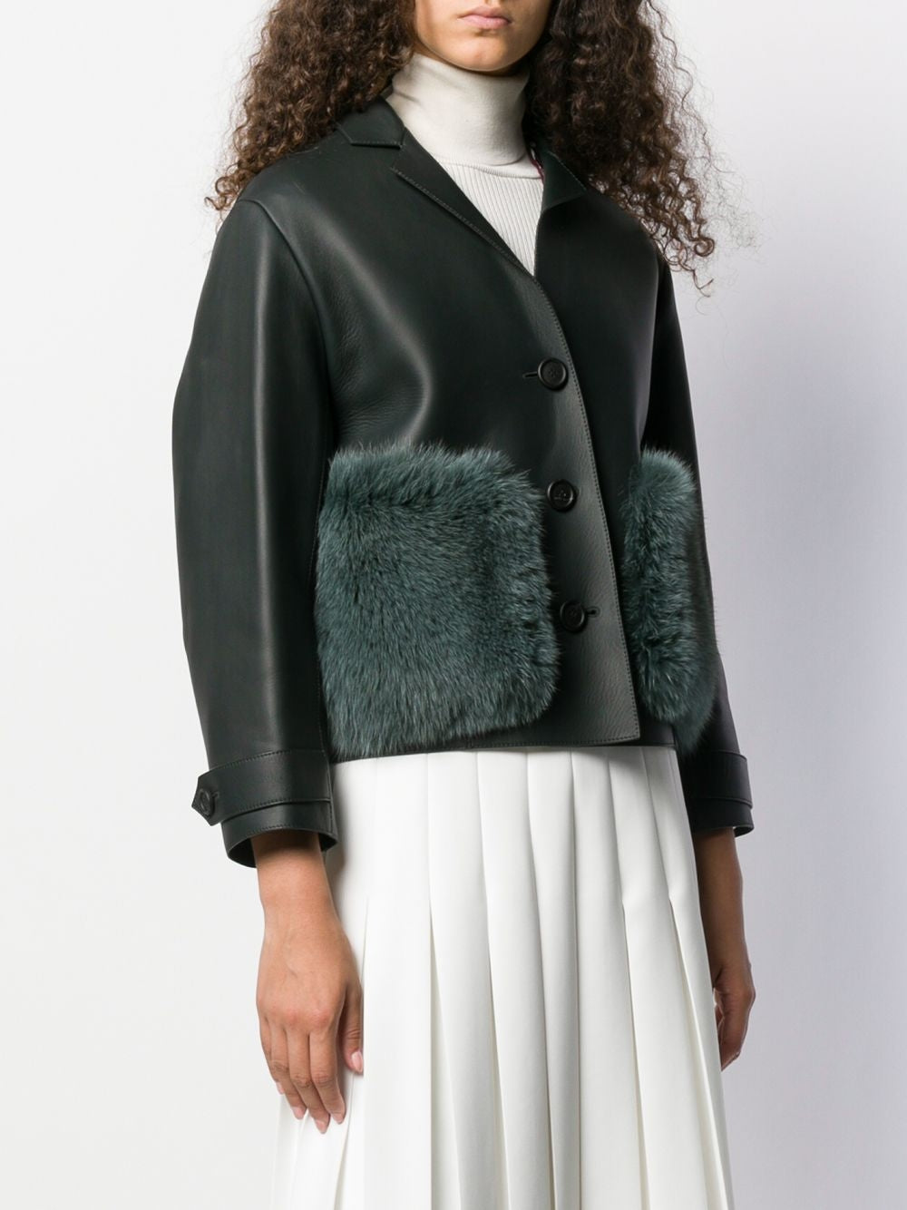 Burberry Prorsum black leather jacket with collar, button-front fastening, cropped silhouette, long sleeves, and oversized fur-trimmed front patch pockets.