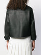 Burberry Prorsum black leather jacket with collar, button-front fastening, cropped silhouette, long sleeves, and oversized fur-trimmed front patch pockets.