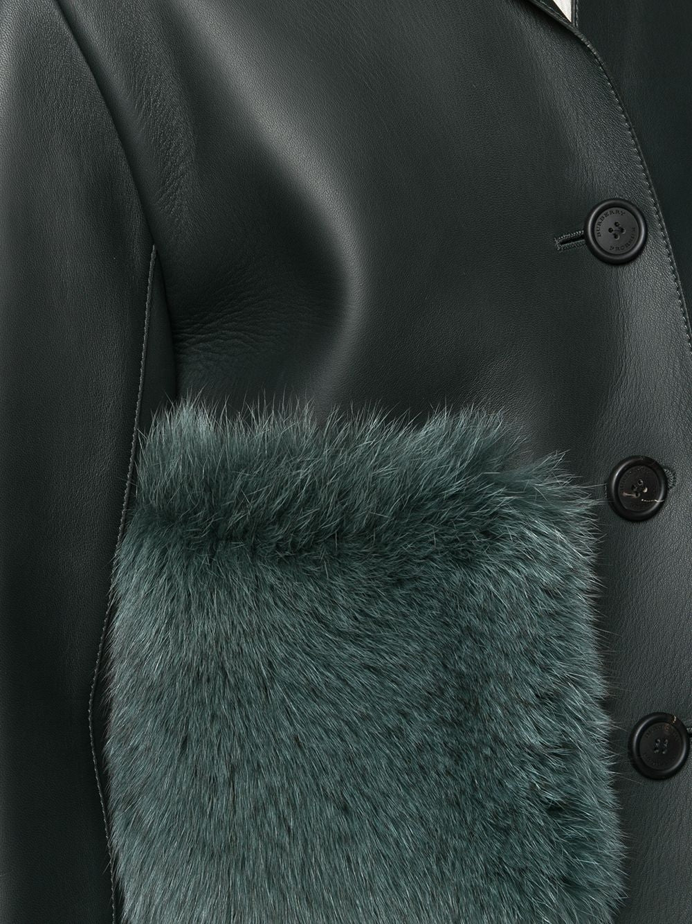 Burberry Prorsum black leather jacket with collar, button-front fastening, cropped silhouette, long sleeves, and oversized fur-trimmed front patch pockets.