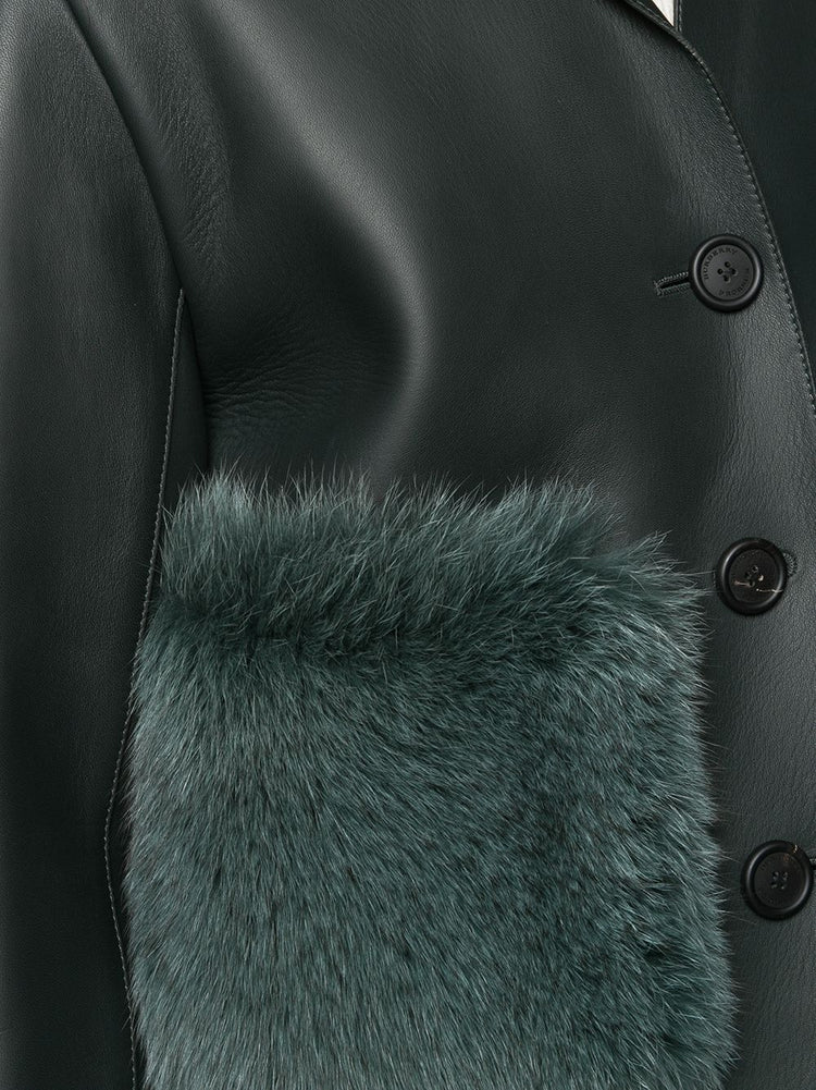 Burberry Prorsum black leather jacket with collar, button-front fastening, cropped silhouette, long sleeves, and oversized fur-trimmed front patch pockets.