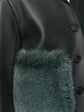 Burberry Prorsum black leather jacket with collar, button-front fastening, cropped silhouette, long sleeves, and oversized fur-trimmed front patch pockets.