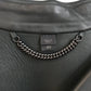 Burberry Prorsum black leather jacket with collar, button-front fastening, cropped silhouette, long sleeves, and oversized fur-trimmed front patch pockets.