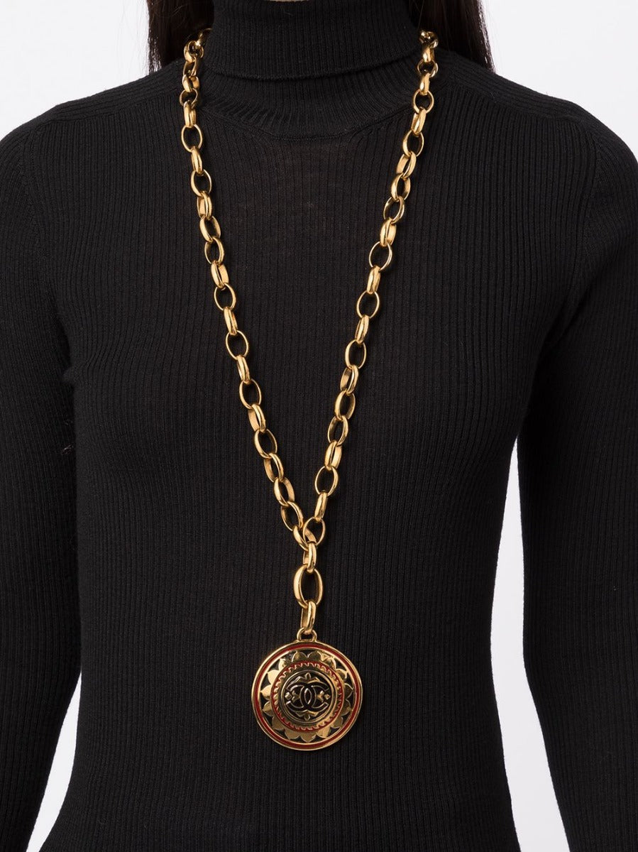 Chanel necklace showing CC medallion pendant close-up