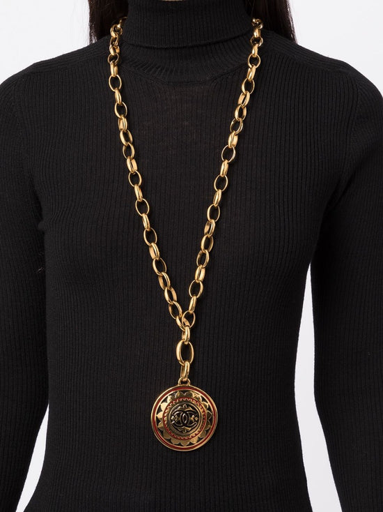 Chanel necklace showing CC medallion pendant close-up