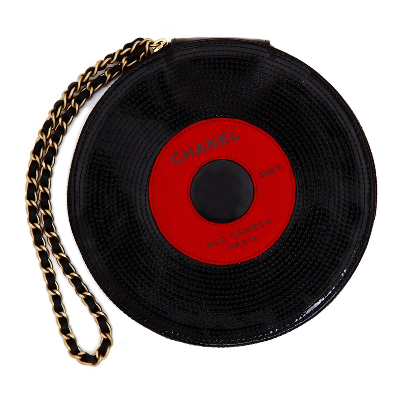 Chanel Music Record Bag clutch in black with silver chain strap, stylish accessory for music lovers and fashion enthusiasts.