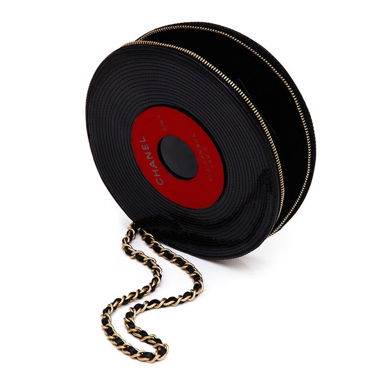 Chanel music record clutch bag with sleek black design and gold accents, stylish accessory for music lovers.
