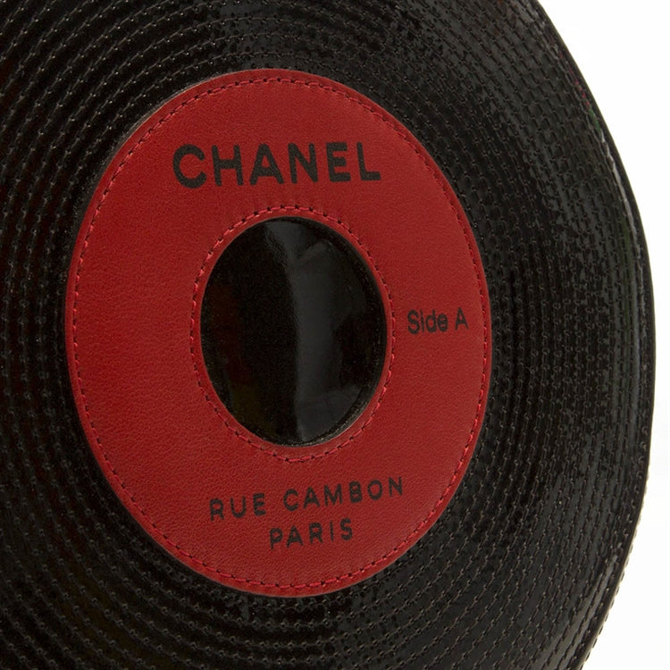 Chanel Music Record Bag clutch with sleek black design, featuring a compact shape perfect for carrying vinyl records.