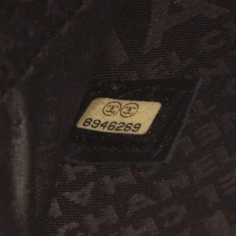 Chanel music record clutch bag in black with chain strap, stylish accessory for music lovers and fashion enthusiasts.
