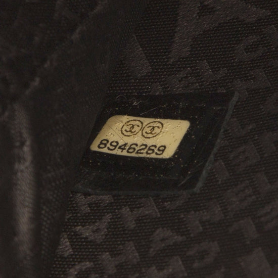Chanel music record clutch bag in black with chain strap, stylish accessory for music lovers and fashion enthusiasts.