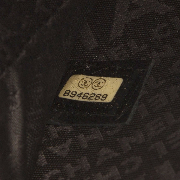 Chanel music record clutch bag in black with chain strap, stylish accessory for music lovers and fashion enthusiasts.