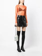 Chanel Lait de Coco Milk Carton Bag in metallic silver with structured carton shape, top handle, chain strap, pearl-style lettering and novelty runway design.