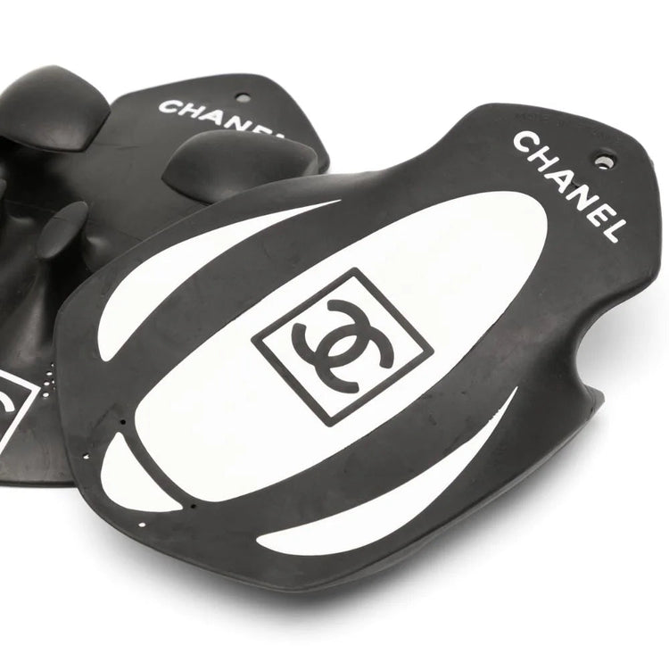 Chanel limited edition black swimming paddles pair, shown from a side angle