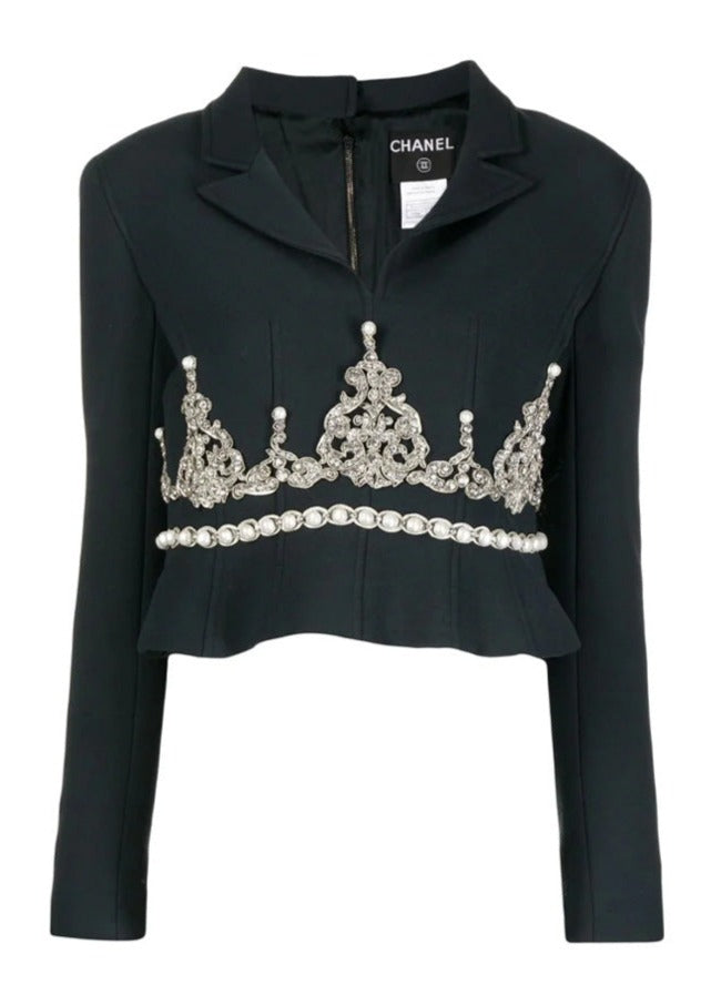 Black Chanel blazer with rhinestone embellishments, tailored fit, and elegant lapel, perfect for stylish formal occasions.