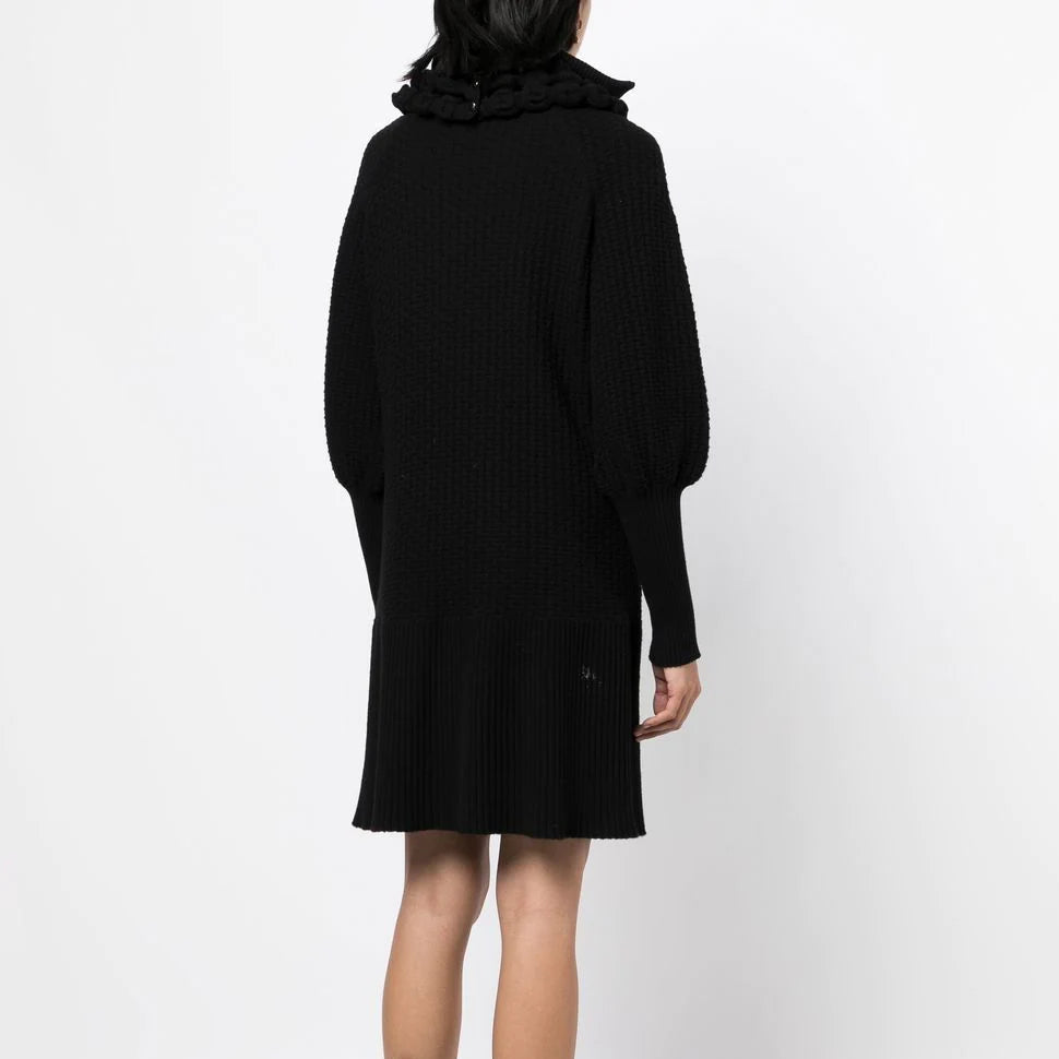 Black textured knit Chanel dress with a collared neckline, elegant and stylish for sophisticated occasions.