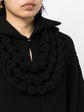 Black textured knit dress with a collared neckline by Chanel, showcasing elegant, tailored fashion for sophisticated style.