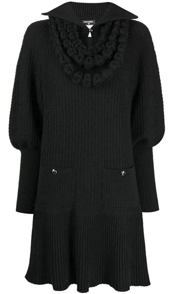 Chanel black textured knit dress with oversized pointed collar, sculptural looped neckline detailing, long blouson sleeves, front patch pockets and ribbed flared hem.