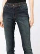 Chanel stonewashed skinny jeans trousers with a fitted design, detailed close-up of fabric texture and stitching.