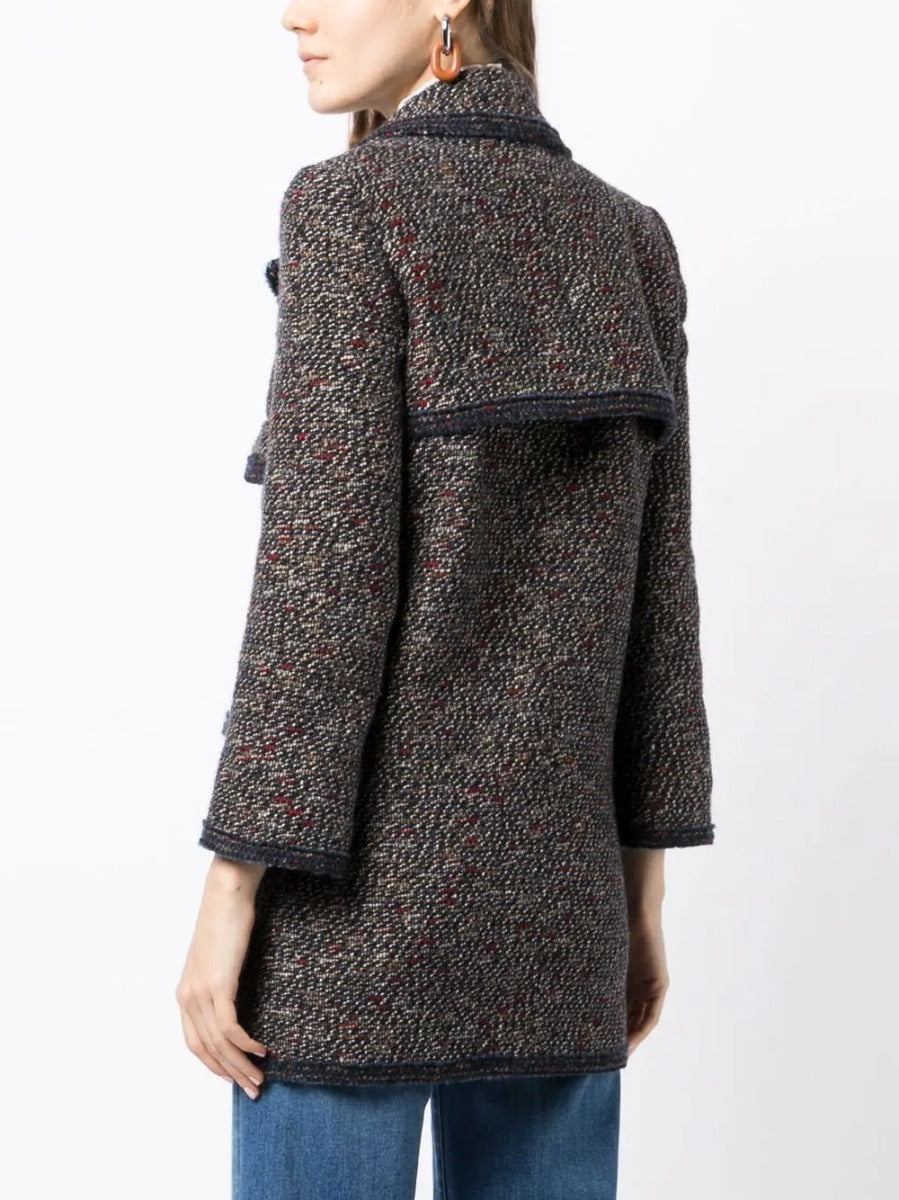 Chanel layered tweed jacket, stylish blazer with textured fabric, classic design, suitable for elegant or casual wear.