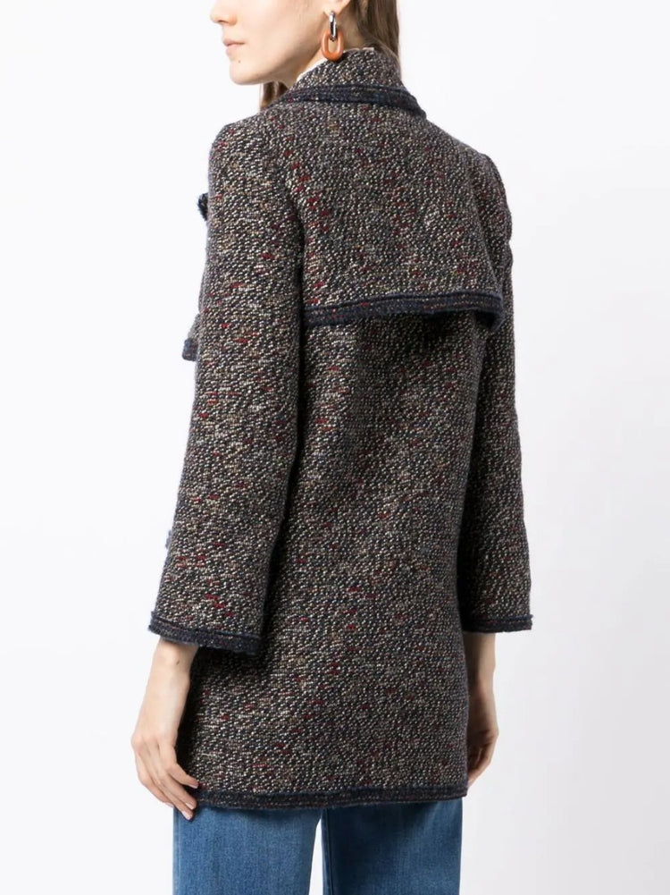 Chanel layered tweed jacket, stylish blazer with textured fabric, classic design, suitable for elegant or casual wear.