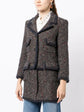 Chanel layered tweed jacket with classic design, featuring textured fabric and tailored fit, stylish blazer for sophisticated looks.