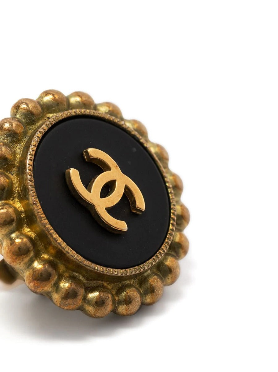 Chanel button earring, side view showing clip-on fastening